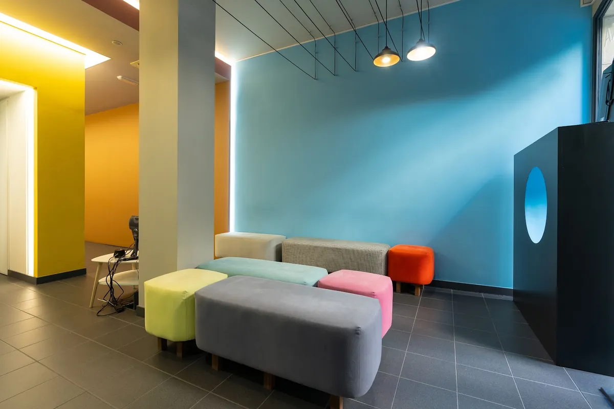 Waiting room with blue and yellow painted walls
